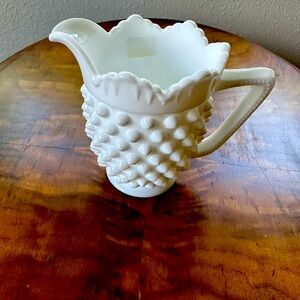 White cream container.